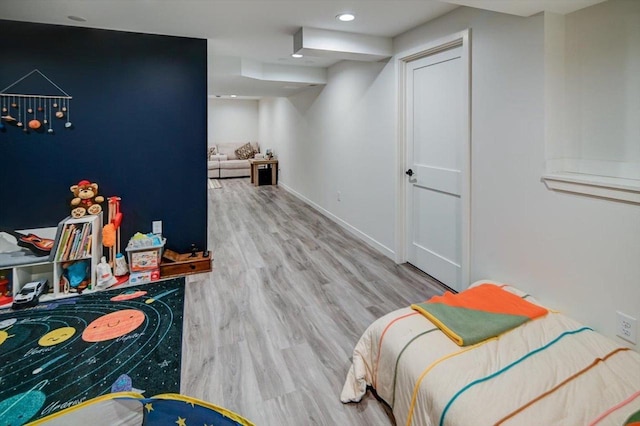 bedroom with recessed lighting, baseboards, and wood finished floors