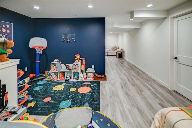 rec room with recessed lighting, baseboards, and wood finished floors