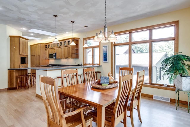 3018 Waubesa Ave, Madison, WI 53711 - dining space featuring light wood finished floors, baseboards, and recessed lighting