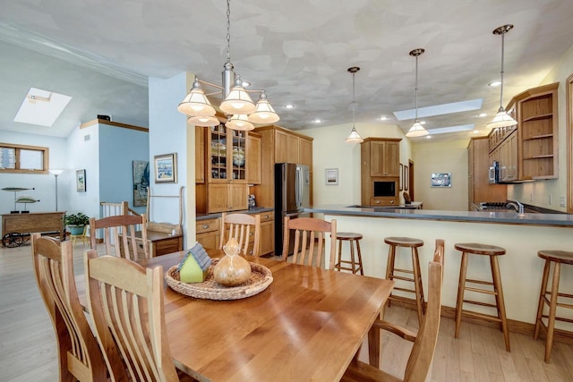 3018 Waubesa Ave, Madison, WI 53711 - dining area with a skylight, recessed lighting, and light wood finished floors