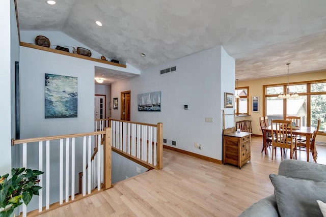 3018 Waubesa Ave, Madison, WI 53711 - living area with light wood-style flooring, recessed lighting, vaulted ceiling, a chandelier, and baseboards