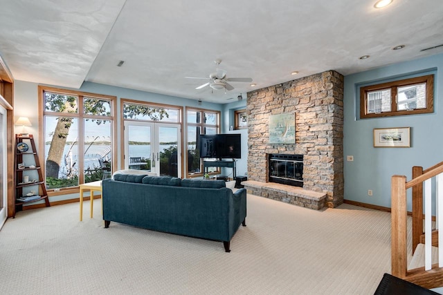 3018 Waubesa Ave, Madison, WI 53711 - living room with light carpet, a ceiling fan, healthy amount of natural light, a fireplace, and recessed lighting