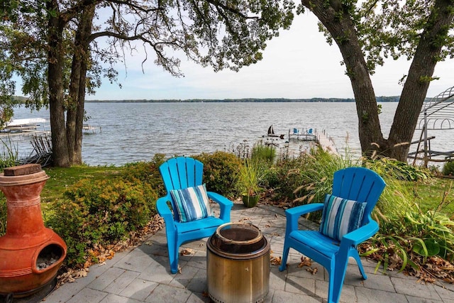 3018 Waubesa Ave, Madison, WI 53711 - view of patio featuring a water view and an outdoor fire pit