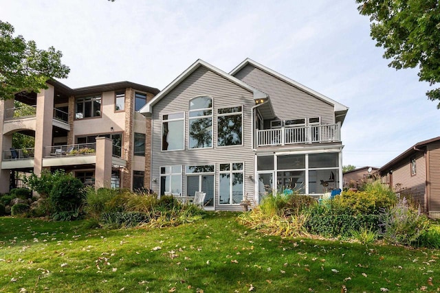 3018 Waubesa Ave, Madison, WI 53711 - back of property featuring a balcony and a lawn