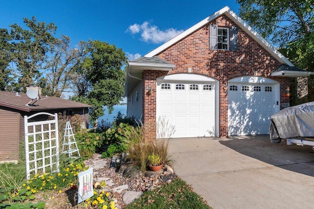 3018 Waubesa Ave, Madison, WI 53711 - view of front of house with brick siding and driveway