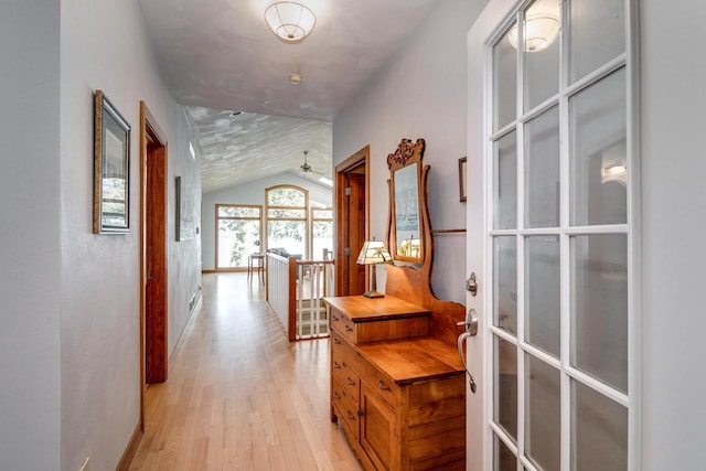 3018 Waubesa Ave, Madison, WI 53711 - corridor with lofted ceiling, an upstairs landing, light wood finished floors, french doors, and baseboards