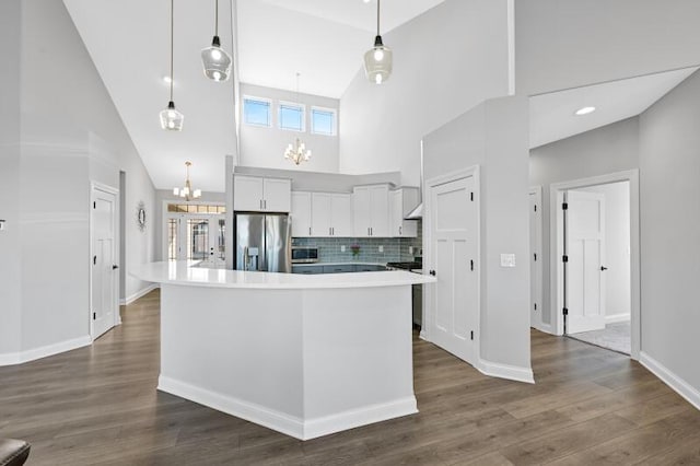 kitchen featuring dark wood-style floors, an inviting chandelier, light countertops, white cabinets, and stainless steel refrigerator with ice dispenser