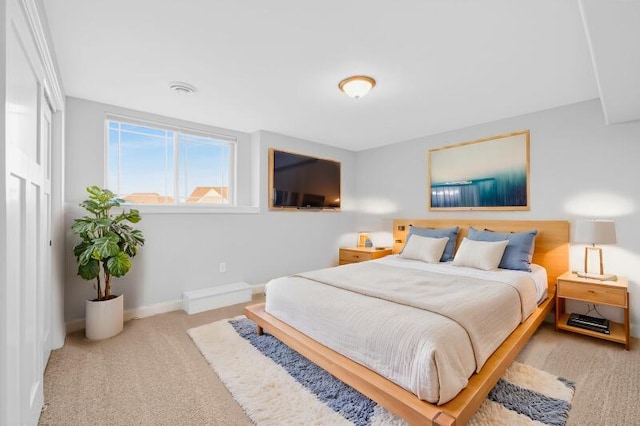 carpeted bedroom with baseboards