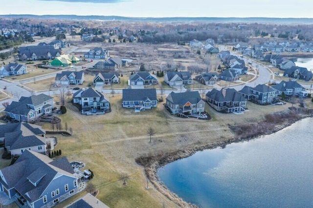 birds eye view of property with a residential view and a water view