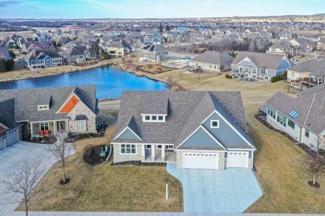 aerial view with a residential view and a water view