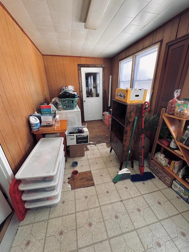 interior space with light floors and wood walls