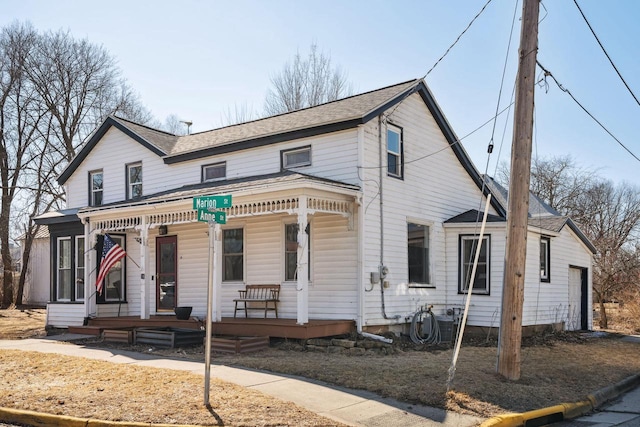 view of front of house featuring covered porch and a garage