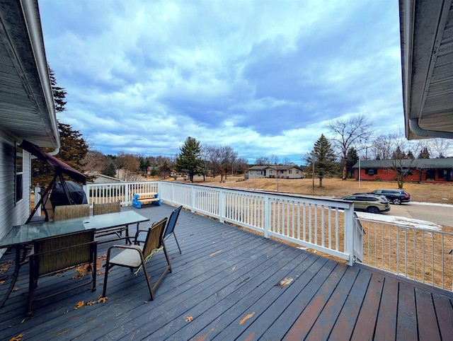 wooden deck featuring outdoor dining space