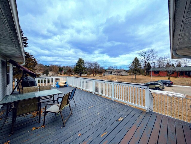 deck featuring outdoor dining area