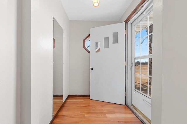 hallway with light wood finished floors