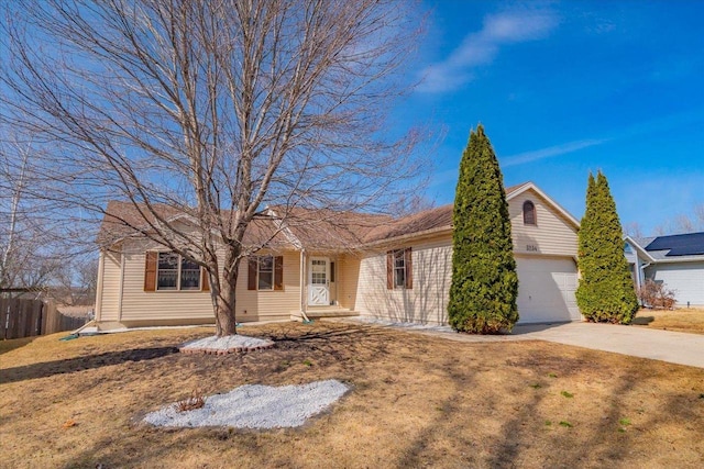 single story home featuring a front lawn, concrete driveway, a garage, and fence