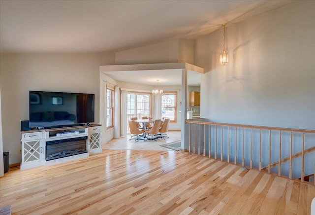 interior space featuring wood finished floors and a chandelier