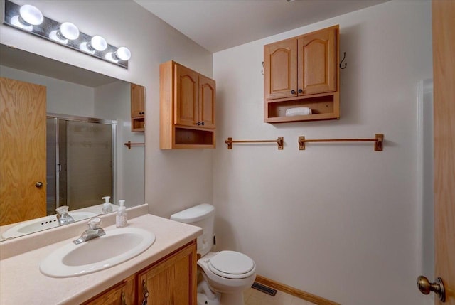 full bath with visible vents, toilet, a stall shower, baseboards, and vanity