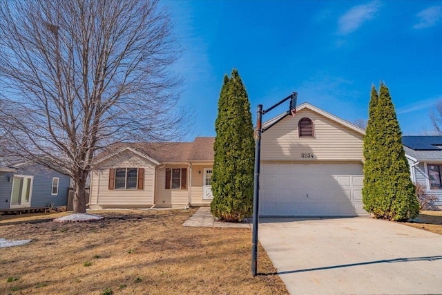 single story home featuring driveway and an attached garage