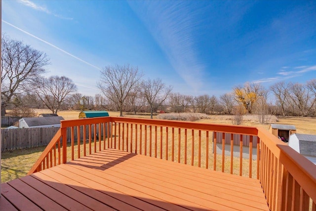 wooden deck with a yard and fence