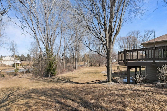 view of yard featuring a wooden deck