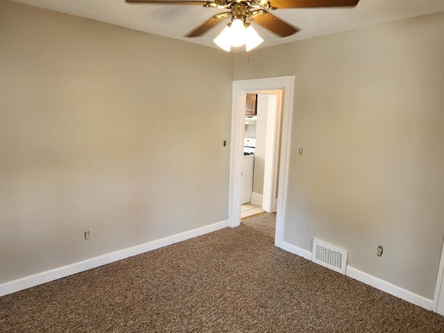 empty room with visible vents, baseboards, light colored carpet, and a ceiling fan