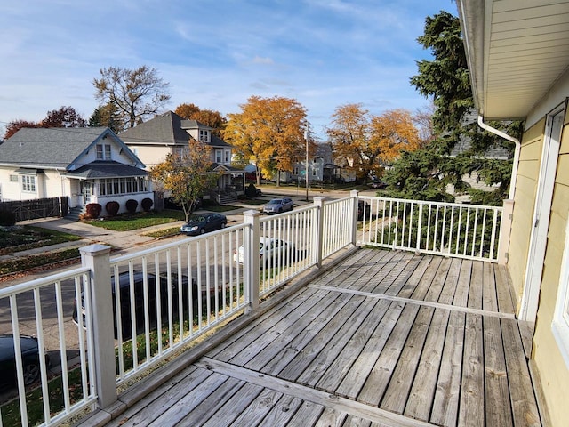 wooden deck featuring a residential view