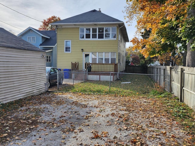 back of property featuring a fenced backyard