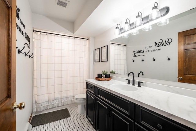 bathroom with visible vents, toilet, and vanity