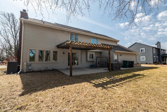 rear view of property with a yard, a pergola, a chimney, central air condition unit, and a patio area