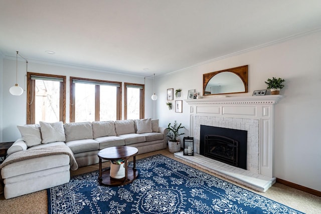 living area featuring a fireplace, baseboards, and ornamental molding