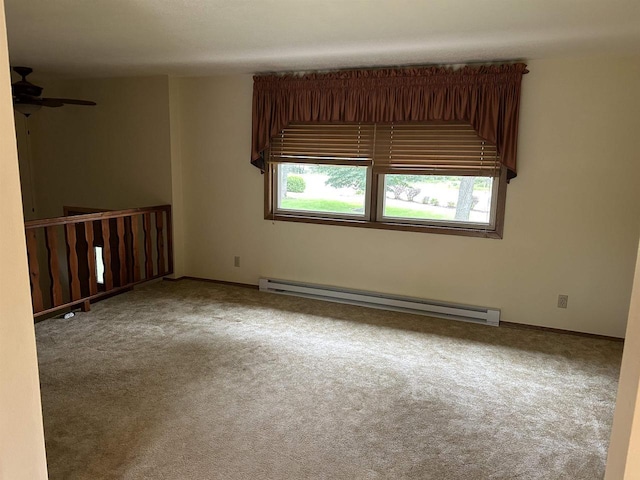 unfurnished room featuring baseboards, carpet floors, and baseboard heating