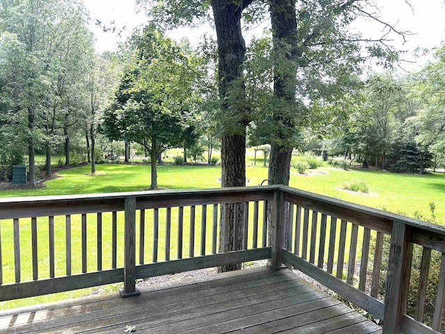 wooden deck with a yard