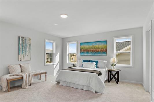 bedroom with baseboards and carpet floors