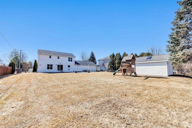 view of yard featuring a playground and fence