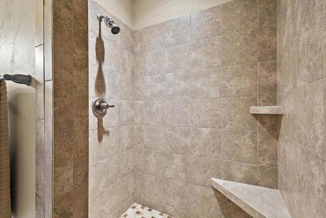 full bath with tiled shower