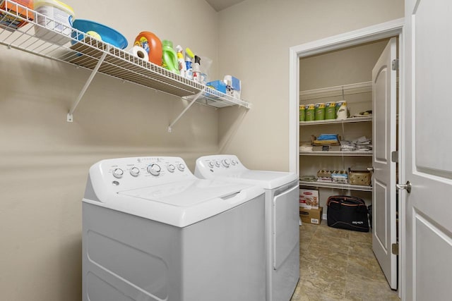 washroom featuring laundry area and washer and clothes dryer