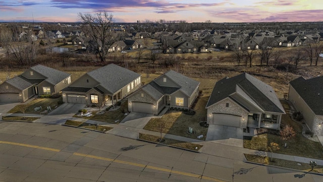 aerial view at dusk with a residential view