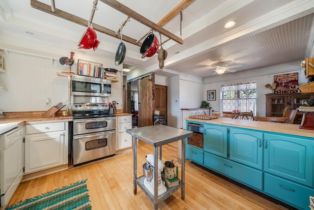 kitchen with light wood finished floors, ceiling fan, stainless steel appliances, white cabinetry, and blue cabinets