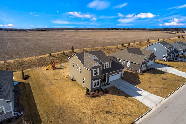 birds eye view of property featuring a rural view