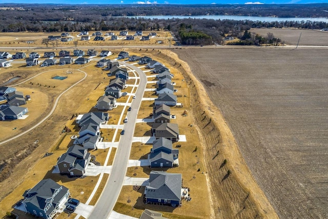 bird's eye view featuring a residential view and a water view