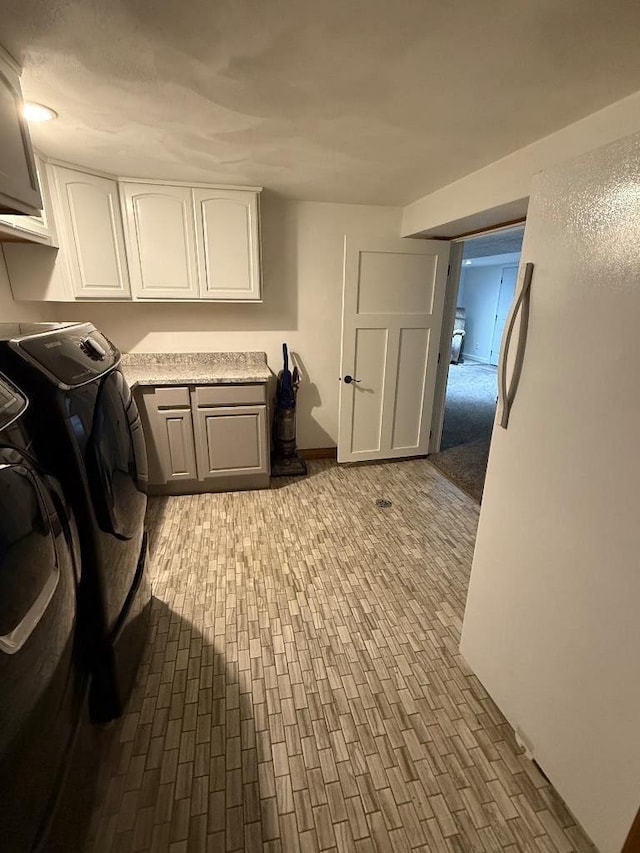 3743 S Milton Shopiere Rd, Janesville, WI 53546 - clothes washing area with cabinet space and washer and clothes dryer