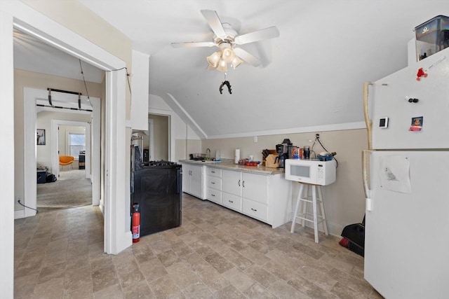 kitchen with ceiling fan, light countertops, lofted ceiling, white cabinets, and white appliances