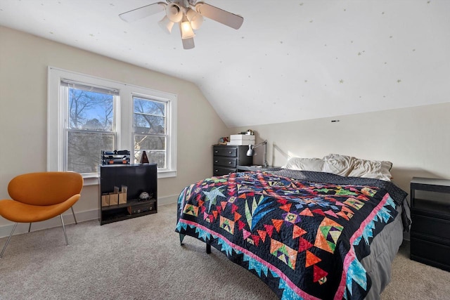 bedroom featuring baseboards, a ceiling fan, carpet, and vaulted ceiling