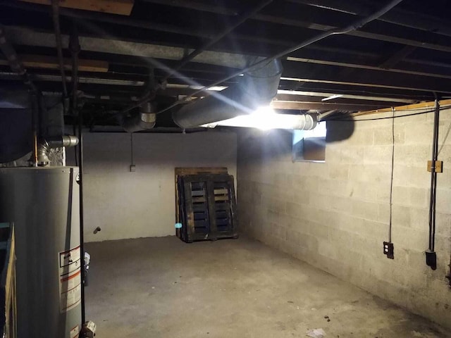 unfinished basement with gas water heater