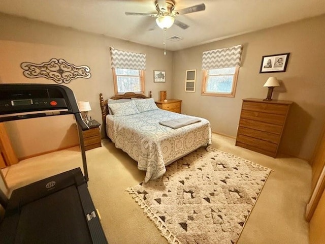 bedroom featuring visible vents, carpet, and ceiling fan