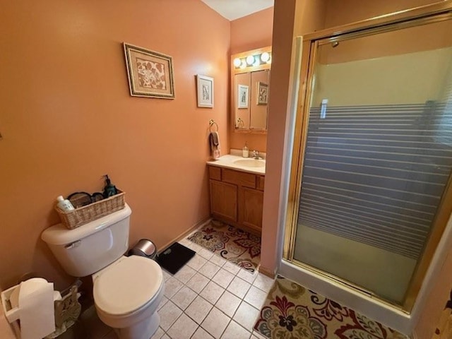 bathroom featuring tile patterned floors, a shower stall, toilet, and vanity