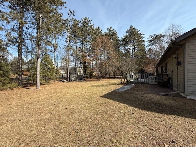 view of yard with a wooden deck