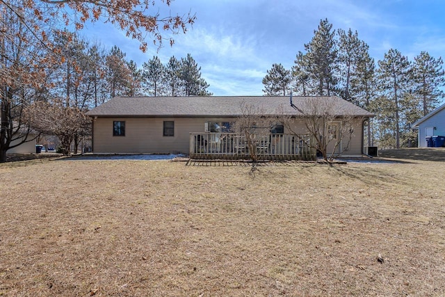 rear view of house with a lawn