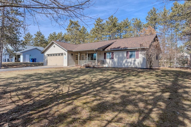 ranch-style house featuring a garage, driveway, a porch, and a front lawn